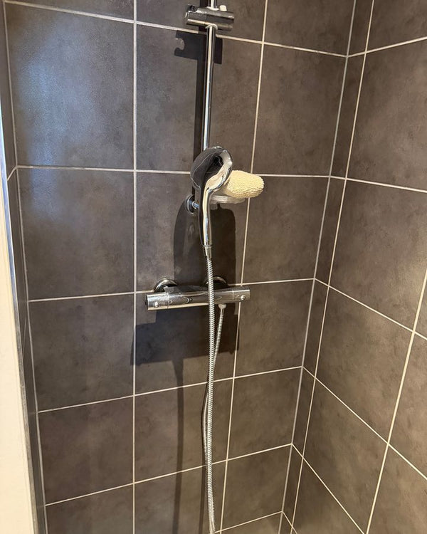 Shower wall and fittings – after