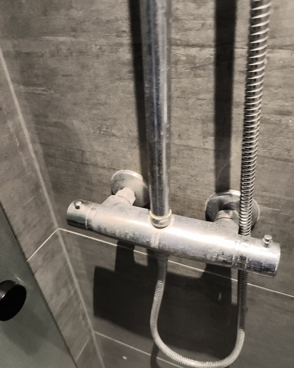 Limescale on shower and thermostat – before